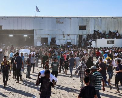 Four people killed after starving Palestinians burst into UN food warehouse in Gaza