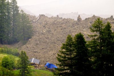 Rock slide hits Swiss Alpine village that authorities had ordered evacuated