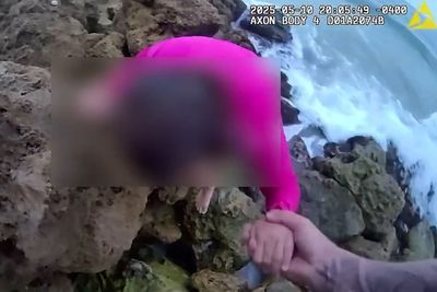 Watch: Missing autistic eight-year-old girl is rescued by police clinging to rocks in Florida