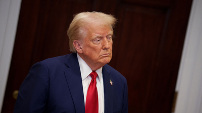 ‘Dragged through HELL’: Trump pardons corrupt sheriff who sold deputy badges for cash envelopes