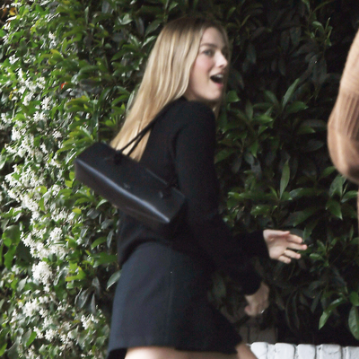 Margot Robbie Puts a Biker Twist on Alaïa's Iconic Le Teckel Bag With Moto Boots and a Mini Skirt