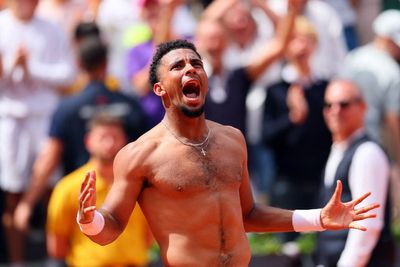Home favourite Arthur Fils defies injury to win wild French Open rollercoaster