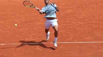 Fils fights off Munar in five-set thriller to reach third round at French Open