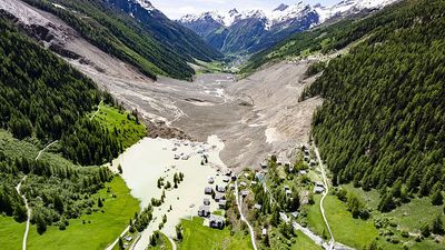 Falling debris forces suspension of search for missing man after landslide buries Swiss village