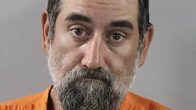 Florida man swims through alligator-infested waters, then attacks police with garden shears