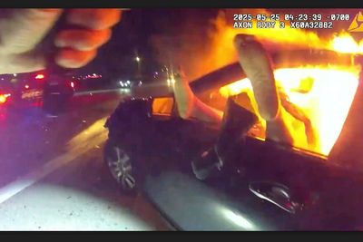 Officer rescues woman from burning car in aftermath of interstate crash in Phoenix