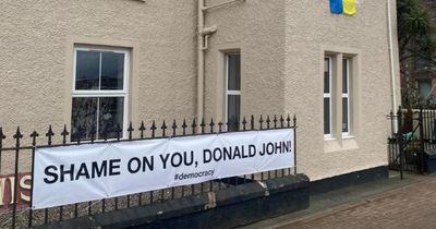 Council orders Hebridean shop owners to remove banner calling out Donald Trump