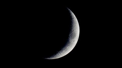 See a lunar scar darken the crescent moon tonight