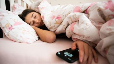 More than 55% of people hit the snooze button daily — here's how it impacts your brain and body
