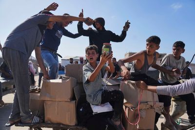 AP PHOTOS: Starving civilians caught in the chaos of food distribution in Gaza