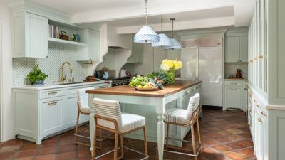 This dated 'dungeon-like' 1980s kitchen has been transformed into a bright, inviting space – it's a lesson in mixing contemporary design with original Spanish Colonial features