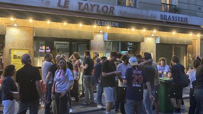 PSG fans gather at their local in Paris to enjoy waltz to Champions League glory