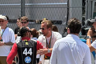 Harry Kane greets Lewis Hamilton as England players take in Spanish Grand Prix