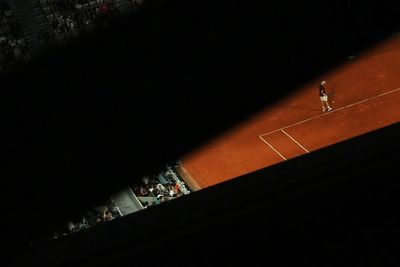 AP PHOTOS: Light and shadows add an extra dimension at the French Open tennis tournament
