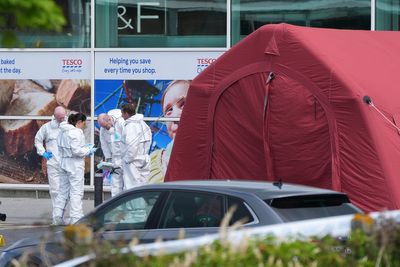 Man who died in supermarket shooting incident fired in the air as shoppers fled