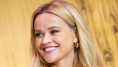 Reese Witherspoon nailed effortless elegance with pretty white cardigan and simple gold hoops