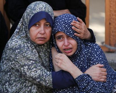 At least 27 Palestinians killed after Israeli military opens fire at food distribution point, local health officials say – as it happened