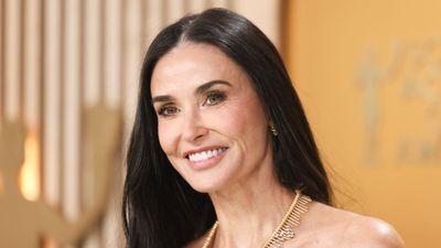 I'm building my holiday wardrobe around Demi Moore's coastal white trousers, striped shirt, and leather flats combination