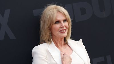 Joanna Lumley reinvents summer tailoring in a sleek white trouser suit and matching brogues