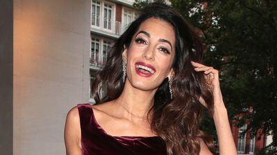 We're taking burgundy into summer with Amal Clooney's polished jumpsuit look - it's ideal for warm weather weddings