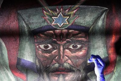 AP PHOTOS: Famed church murals featuring social commentary revived by conservationists