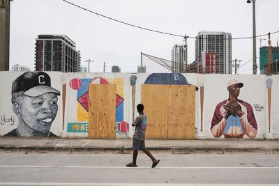 A mural honoring Jackie Robinson and Minnie Miñoso is defaced with racist graffiti in Miami