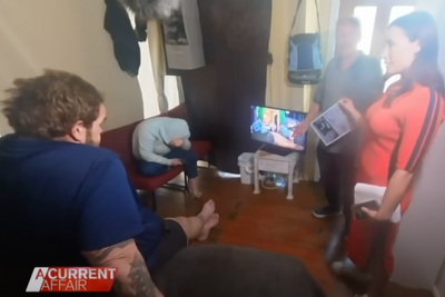 Squatters filmed watching television in man’s home while news crew interview him