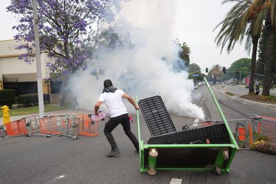 AP PHOTOS: Protesters tear-gassed in Los Angeles after federal immigration arrests