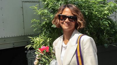 Halle Berry just made a case for the return of ripped jeans - her blazer and sandals brought this denim up to date