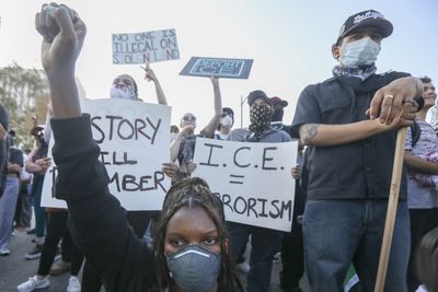 US travel ban takes effect amid LA protests against immigration crackdown