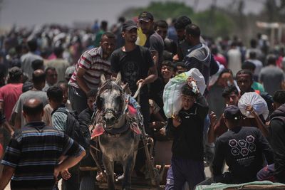 Palestinians say Israel and its allies fired on a crowd near Gaza aid site. Hospital says 14 killed