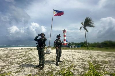Filipino forces and villagers struggle to live in China's shadow in disputed waters