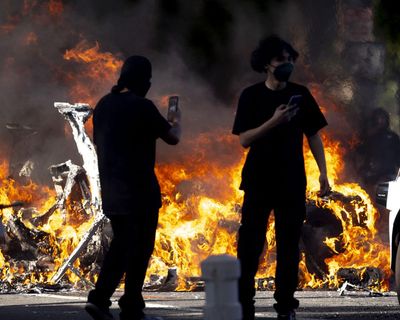 Arrests as curfew begins in downtown LA; Newsom decries Trump’s ‘assault’ on democracy – as it happened