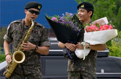 BTS' RM and V tease K-pop boy band's return after being discharged from South Korean military