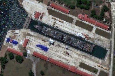 North Korea moves warship from botched launch to dockyard for repairs