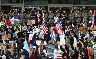 Los Angeles curfew comes into force as Trump says he'll 'liberate' city amid anti-immigration protests and looting
