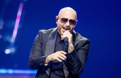 Pitbull says fans wearing bald caps to his concerts proves it's 'deeper than just music'