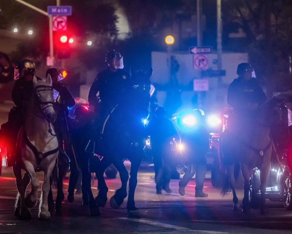 LA police make mass arrests as protesters defy overnight curfew