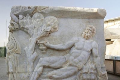 Archaeologists unearth Roman-era sarcophagus showing Greek gods in drinking contest