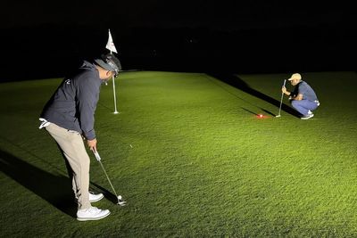 Flashlights and glowing golf balls. How a NY man played for 35 hours in quest for world record