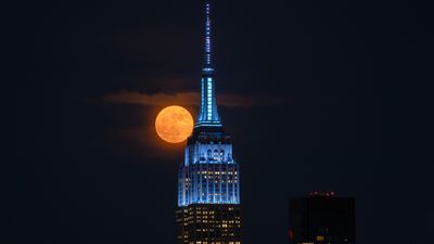 'Strawberry Moon' in pictures: Major lunar standstill sees June's full moon hang low in the sky