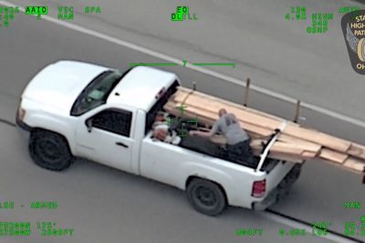 Wild police chase as man in back of pick-up hurls wooden boards at cops before multi-car wrong way crash on highway