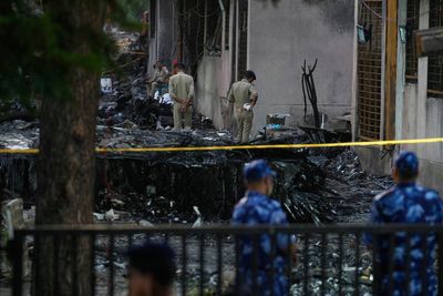 Indian authorities begin probe of Air India plane crash as Modi visits the site