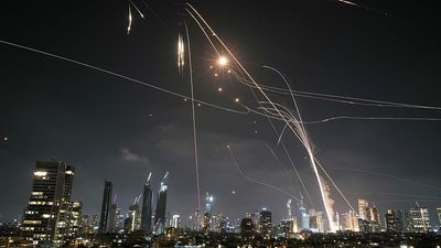 Iran fires dozens of rockets on Israel as Tehran reels from massive attack