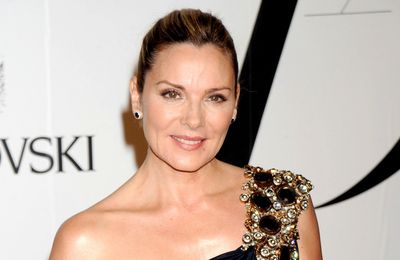 Kim Cattrall has a 'blast' with 'fun playmate' Russell Thomas
