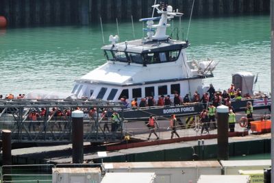 More than 900 people arrived in small boats on Friday