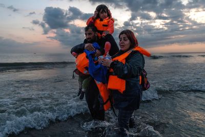 More than 900 migrants reach UK in small boats as French police fire tear gas at families trying to board dinghy
