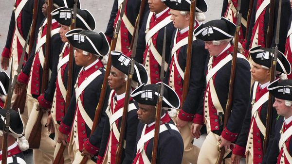 Military parade rolls through Washington as 'No Kings' protesters across US decry Trump