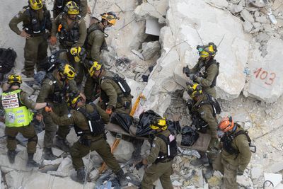 Watch: Rescuers search through Bat Yam rubble after Iran’s deadly attack