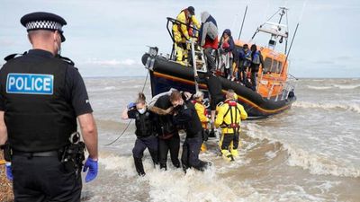 Terrified Migrants Cling to Each Other While Storming Channel Waters